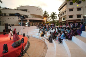 Students attending a cultural program at Educare Institute of Dental Sciences amphitheater during sunset.campus life in Kerala dental college